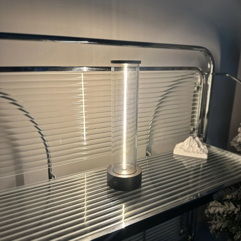 Modern linear glass USB LED night light strip with magnetic adhesive base.