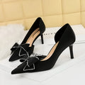 Women's black satin stiletto heel pump with rhinestone bow and side hollow cut-out
