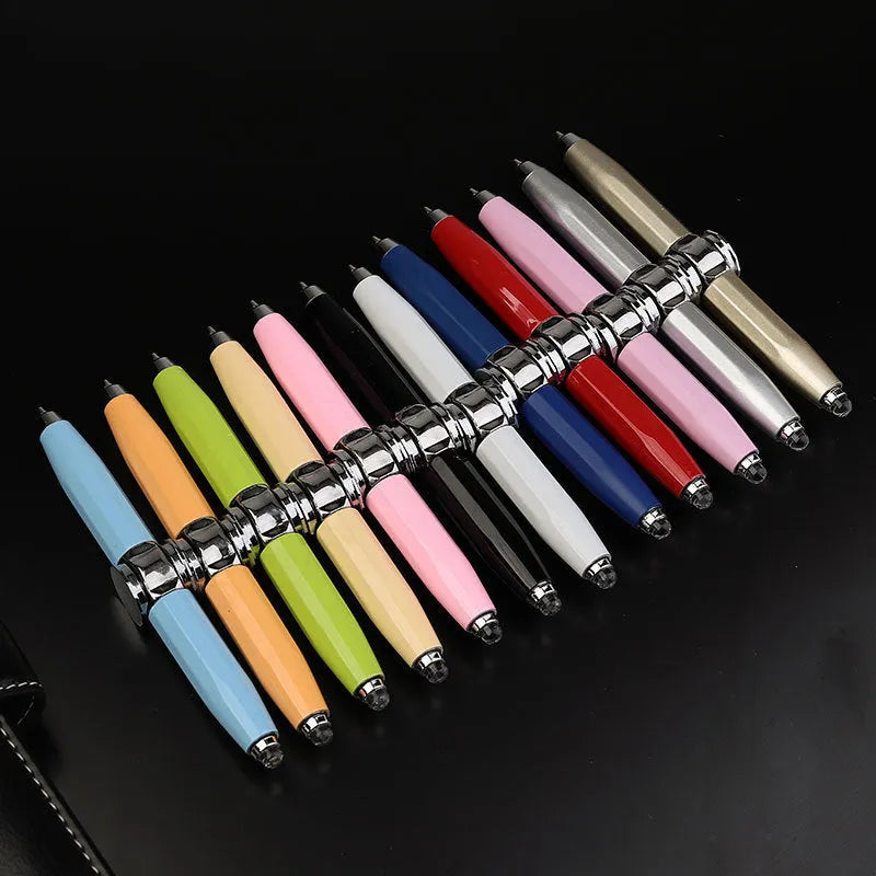 Metal ballpoint pen with integrated LED spinning gyro on the end