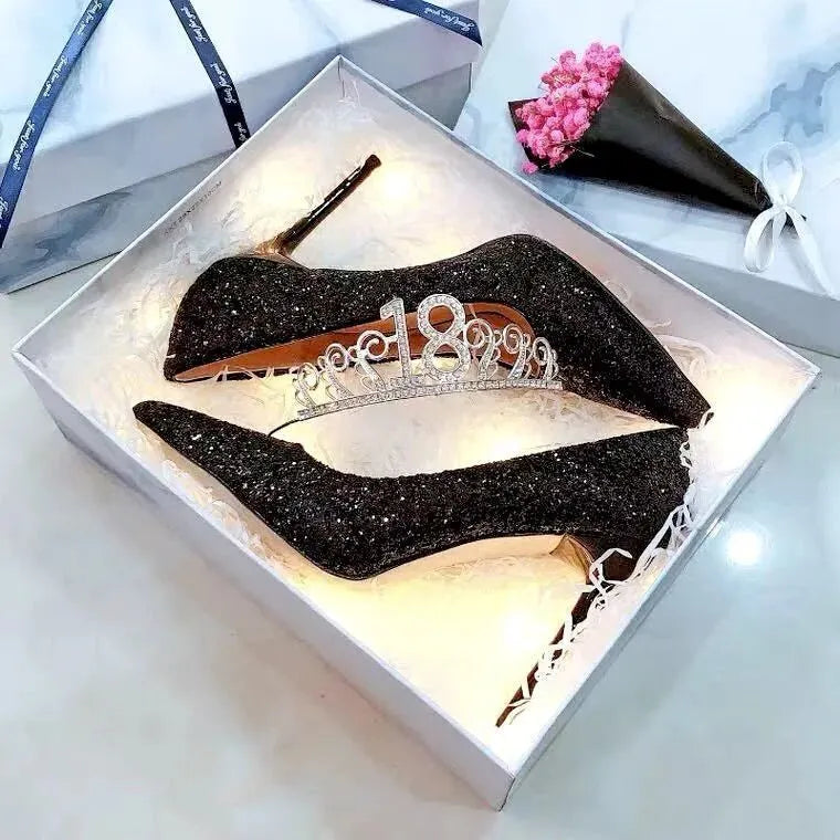 Silver and black PU leather bridal shoes with stiletto heels and crystal detail on a white background.