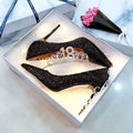 Silver and black PU leather bridal shoes with stiletto heels and crystal detail on a white background.