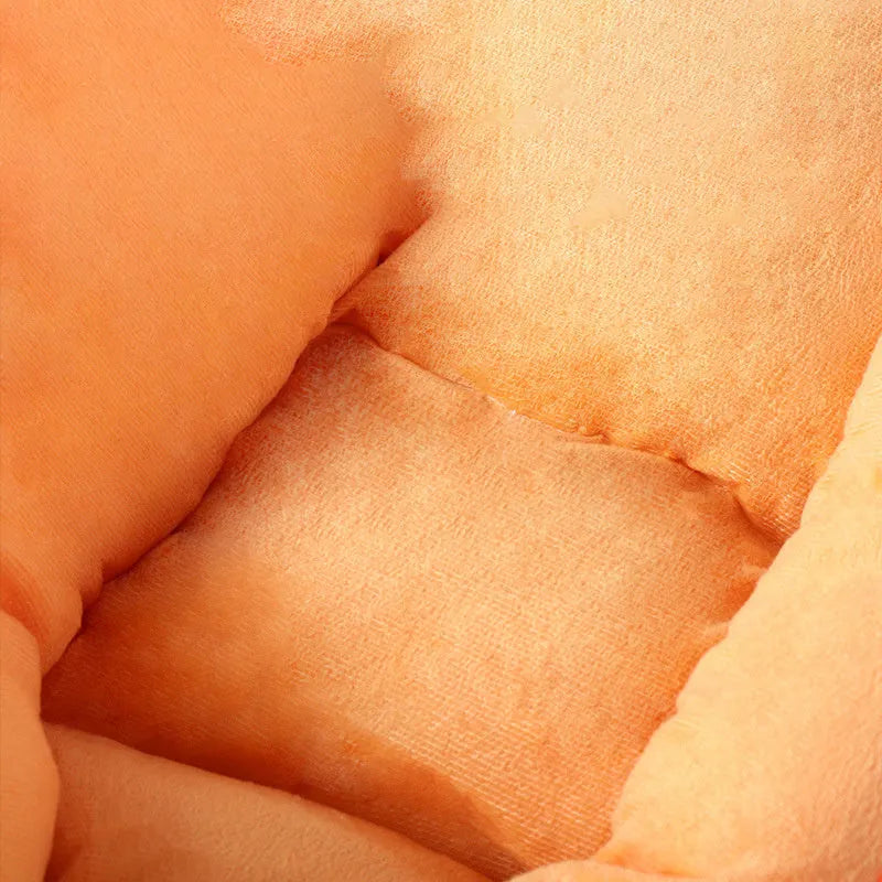 Carrot-shaped nesting dog bed with a soft blanket in two size options for small and medium pets.