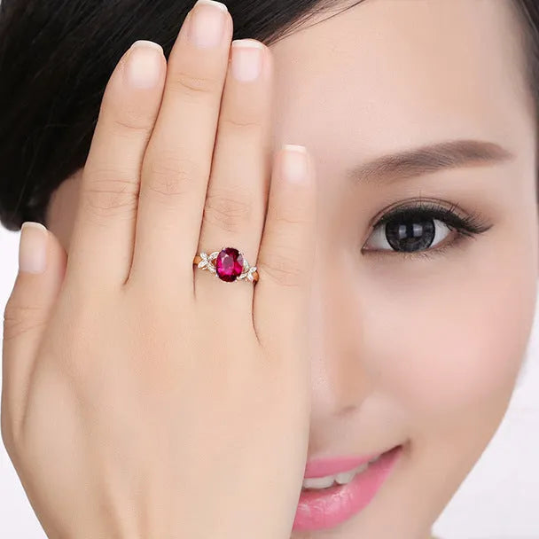 Women's heart-shaped butterfly ring in 18k rose gold plating with red or blue enamel option.