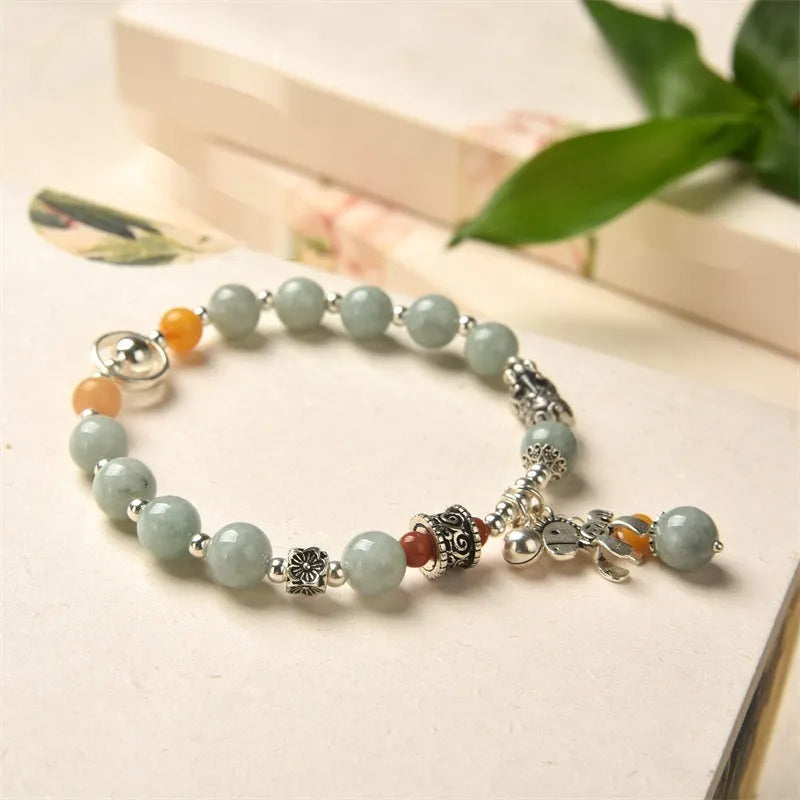 Natural jade vintage bracelet with alloy clasp on a white background.