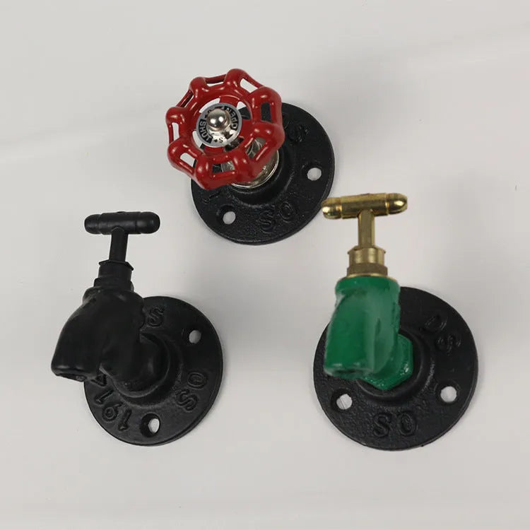 Metal water pipe style wall hanging hook in a choice of colours on a white wall.