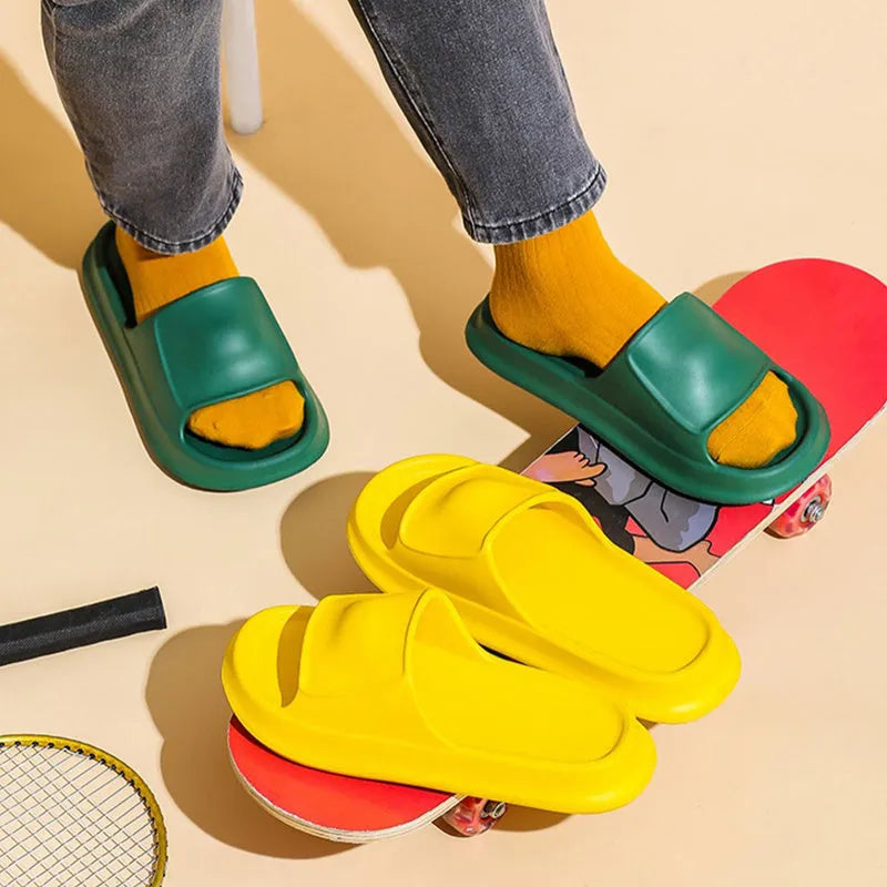 Pair of thick-soled EVA flip flop slippers in a colour option, showing non-slip tread pattern.
