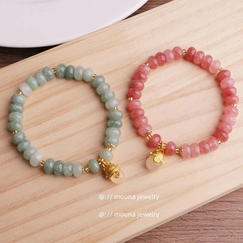 Women's strawberry quartz bracelet with lucky cat charm and animal zodiac modelling in retro style