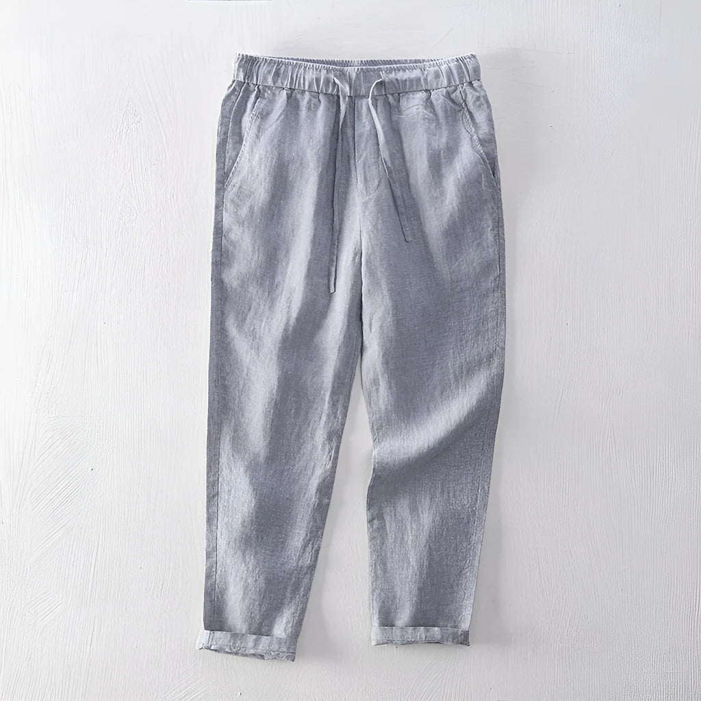 Men's straight leg linen trousers in light grey colour showing mid waist and relaxed fit