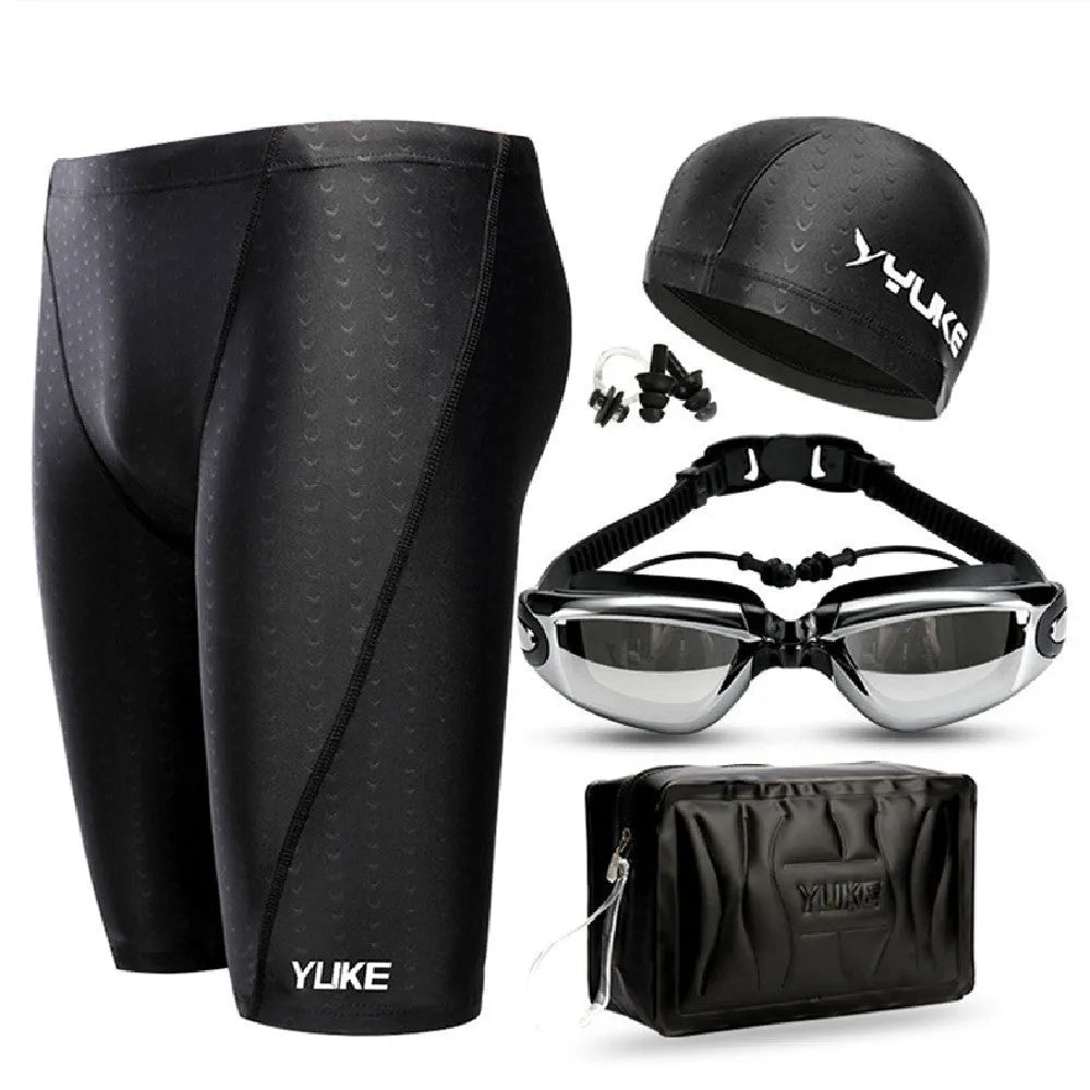 Men's complete swimming set showing briefs, anti-fog goggles, waterproof cap, ear plugs with nose clip, and swimming bag