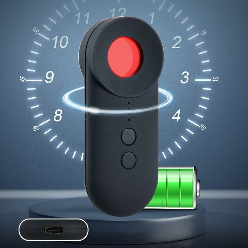 Black portable GPS and hidden camera detector with USB cable on a flat surface.