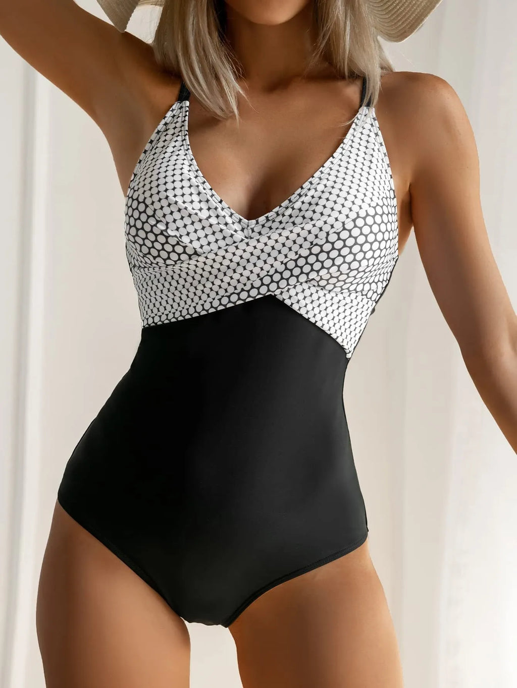 Women's printed lace-up backless one-piece bikini swimsuit on a model, showing floral pattern.