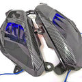 Pair of YAMAHA NMAX side replacement lamps with LED lights and carbon fibre pattern, showing blue illumination option.