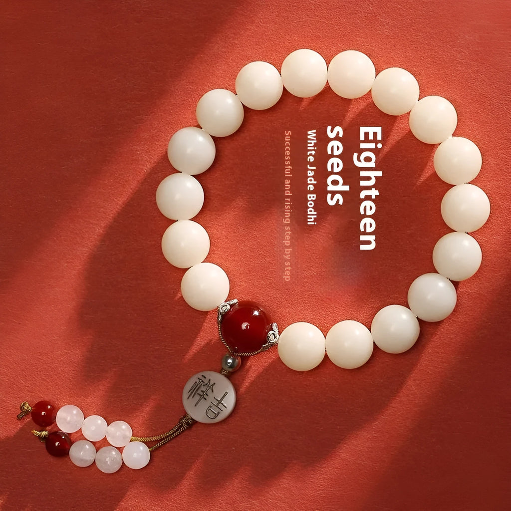 White jade bodhi bracelet with 10mm round seeds and traditional ruyi charm accents