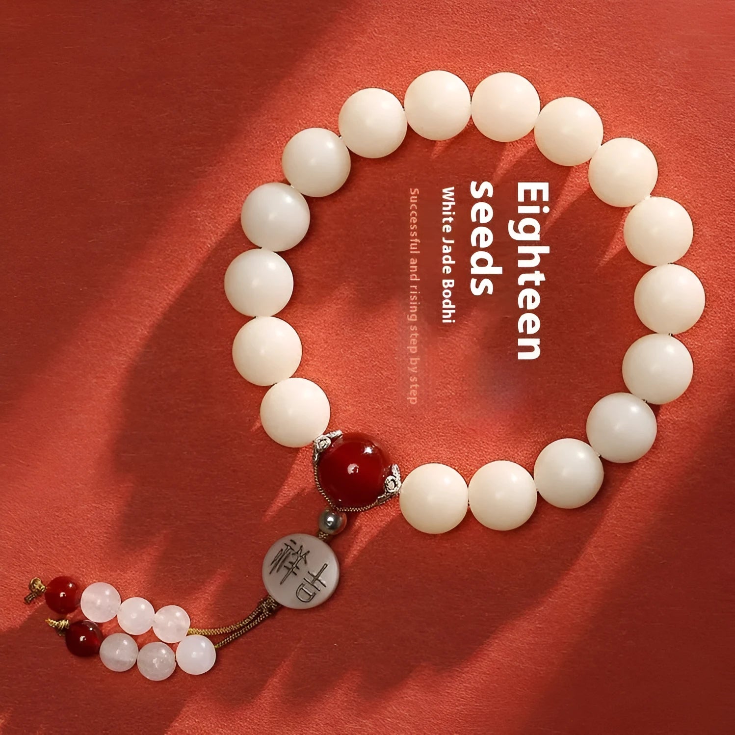 White jade bodhi bracelet with 10mm round seeds and traditional ruyi charm accents