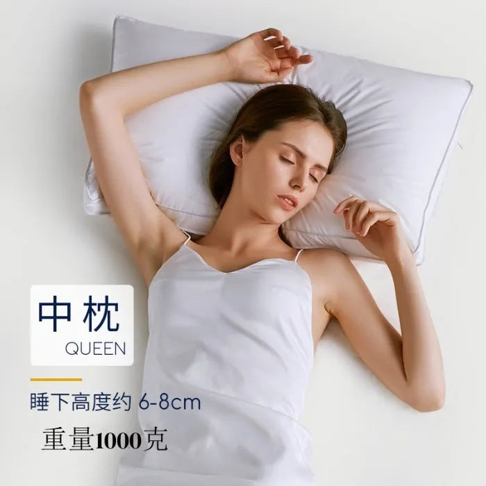 White cotton satin stripe feather pillow showing simple design and hotel-style aesthetic