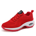 Women's red low-top mesh sneakers with front laces and a flat heel on a white background.