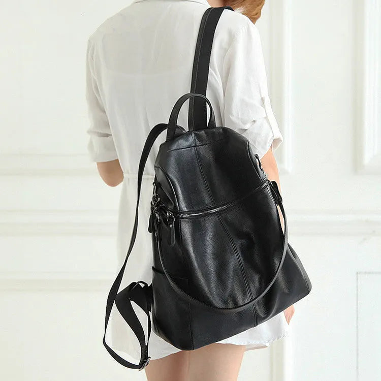 Genuine leather women's retro backpack showing sewing thread details and sandwich pocket