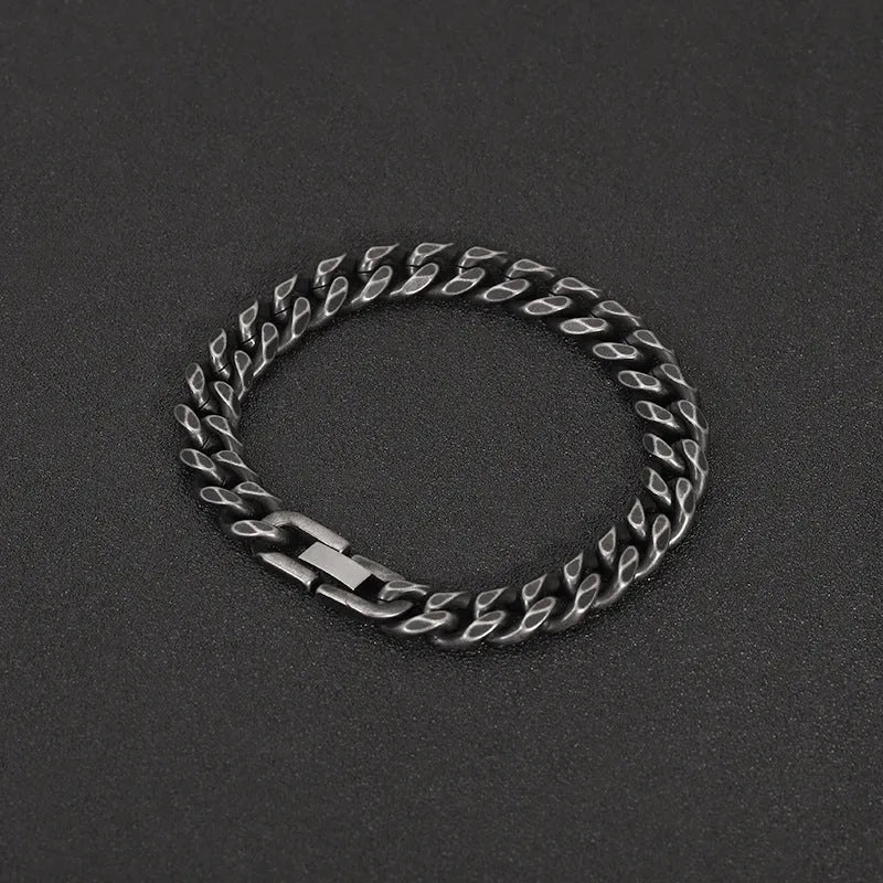 Silver titanium steel geometric minimalist cuff bracelet on flat surface showing 10mm width