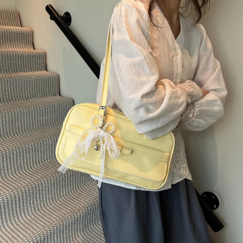Women's black PU leather single-shoulder bag with flap closure and double straps showing internal mobile phone compartment