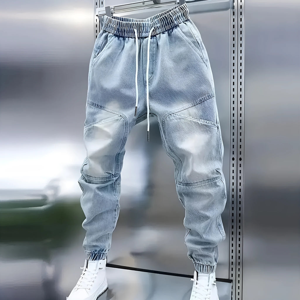 Men's light blue denim pencil pants with elastic ankle bands and drawstring mid waist