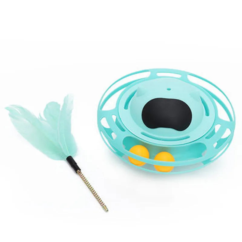 Pink cat tumbler turntable toy with feather attachments on rotation platform