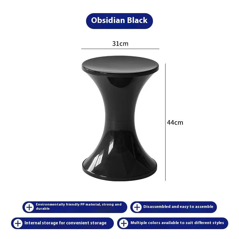 Creative hourglass-shaped plastic stool for changing shoes, shown in a green colour.
