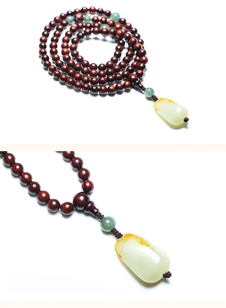 Traditional rosewood prayer bracelet with 108 beads, carved Pterocarpus santalinus decoration, and Hotian jade pendant