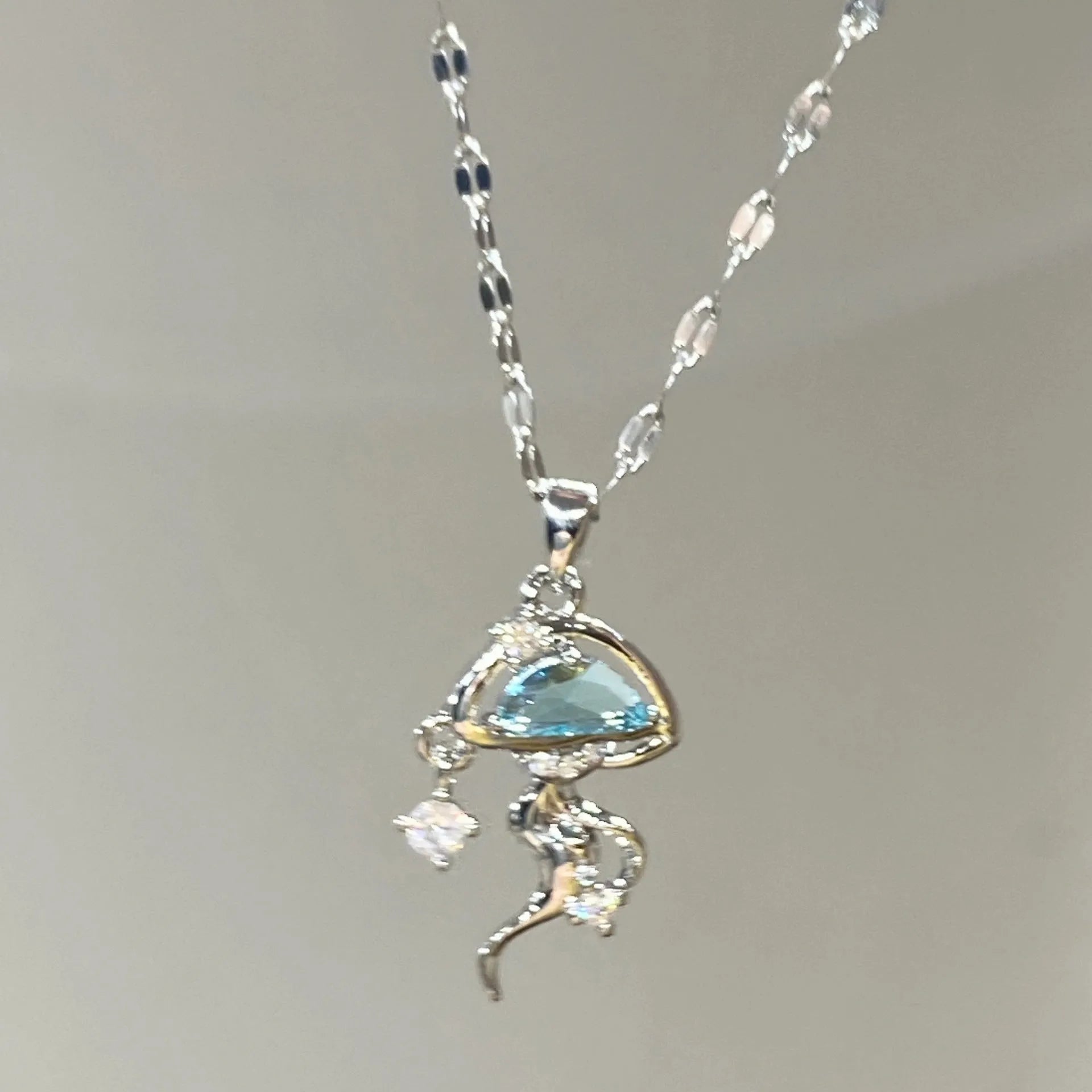 S925 sterling silver blue jellyfish necklace with adjustable chain on white background