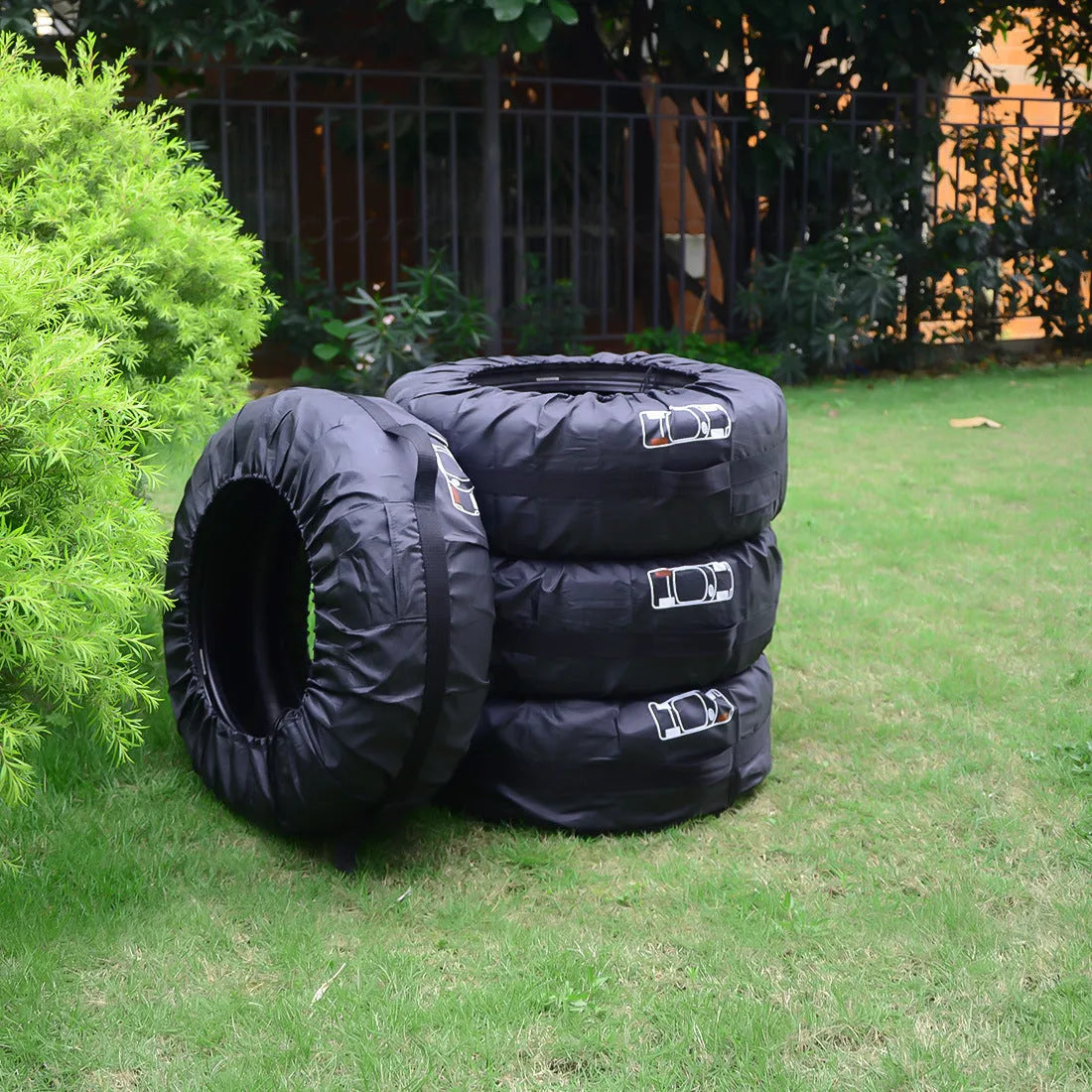 Four oxford cloth car tyre protective covers showing black belt style and red belt style options