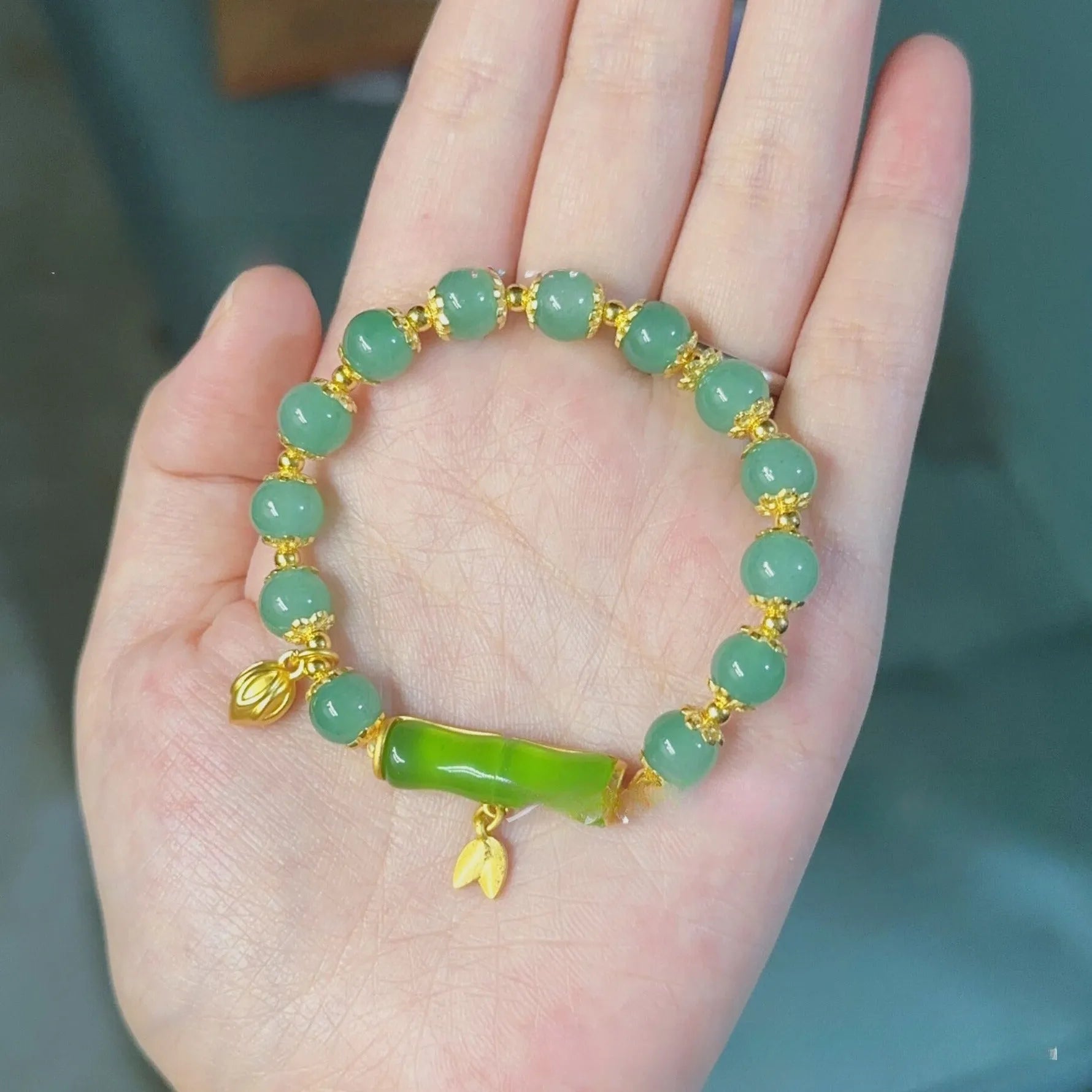 Retro bamboo design bracelet with Ruyi symbol and floral glass beads in electroplated finish