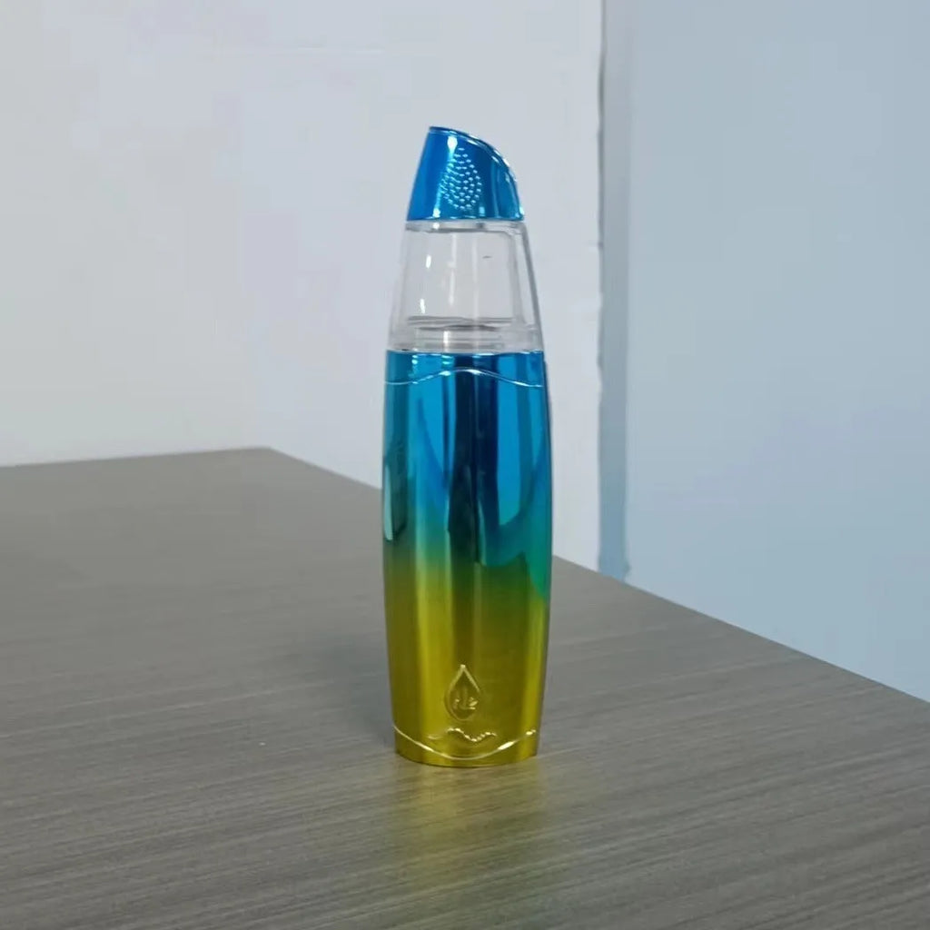 Peacock blue handheld USB rechargeable facial steamer on a white background.