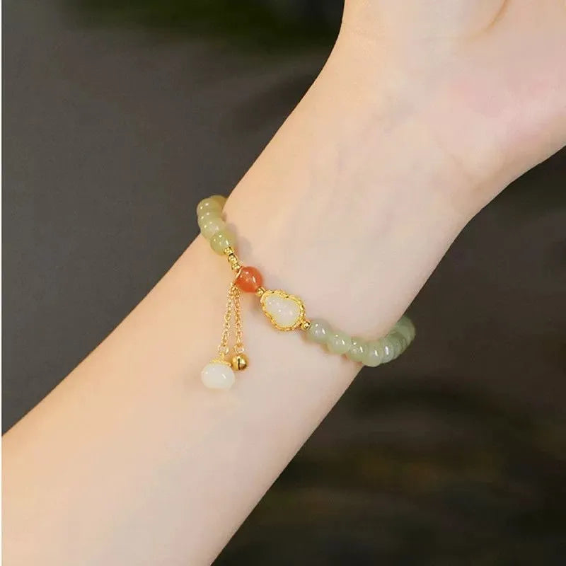 Qingshui jade women's bracelet with gold gourd design and fu character symbol