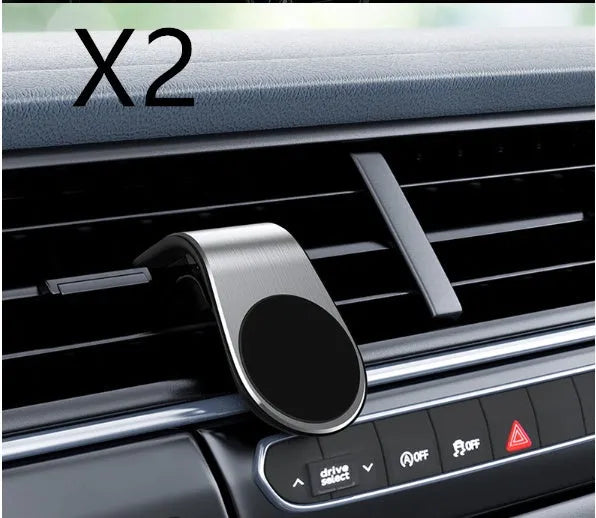 Car phone bracket mounted on vehicle air vent in silver finish showing rotation adjustment