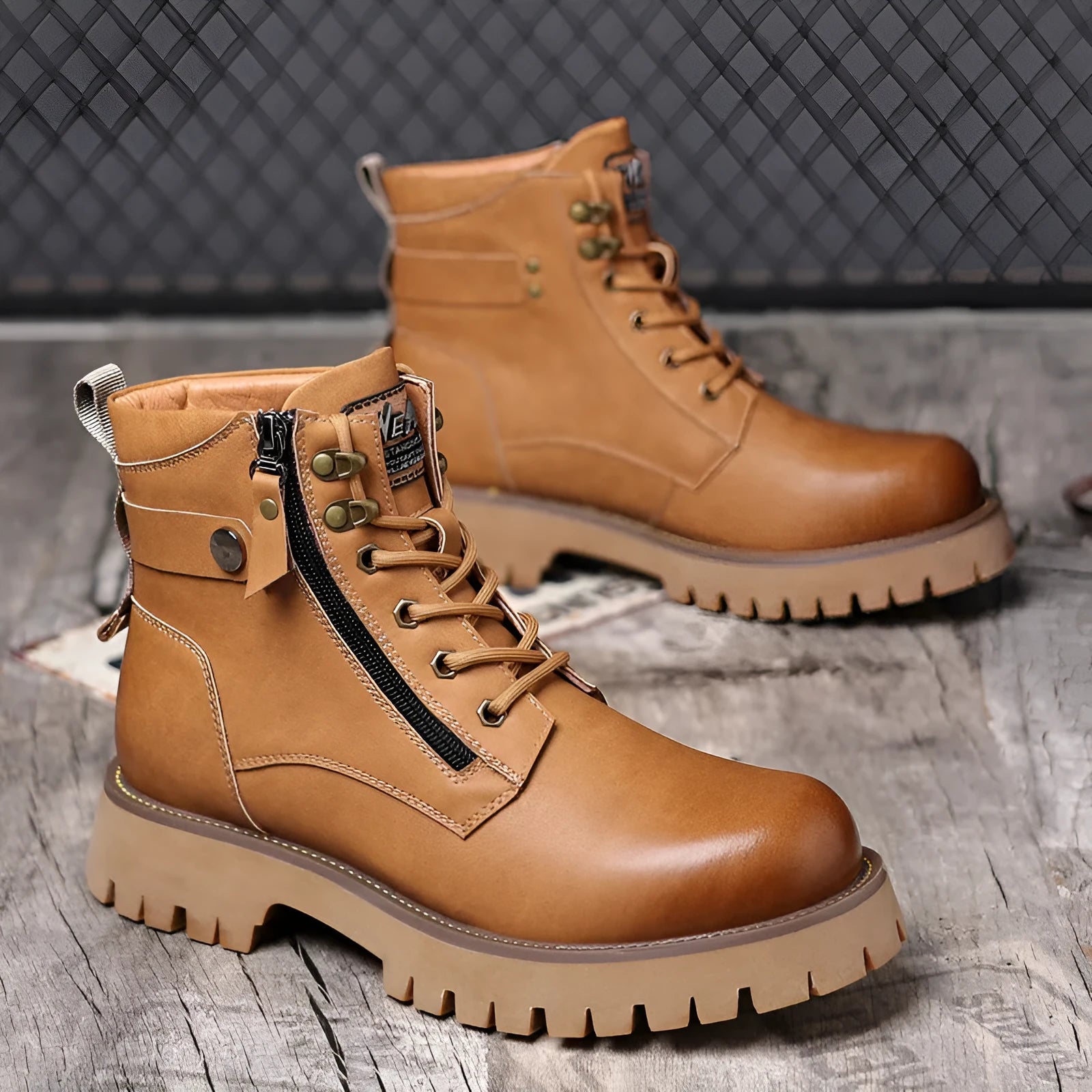 Men's brown leather high-top Martin boots with a side zipper and mid-heel on a wooden floor.