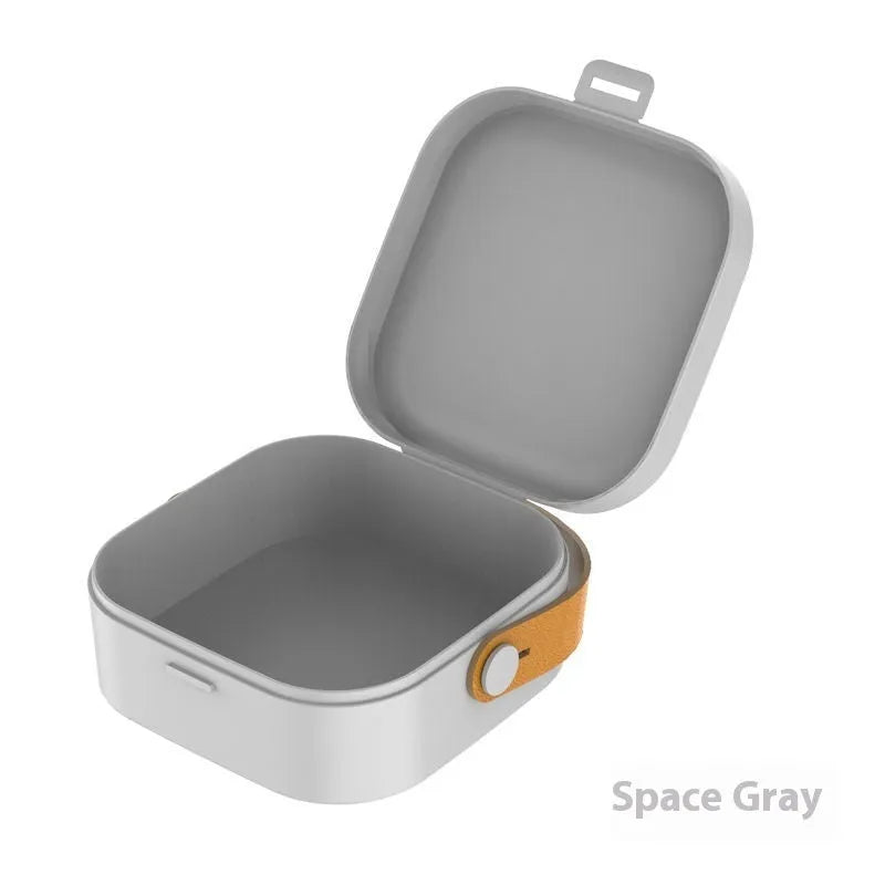 Medium-sized solid colour portable storage box for organising data cables and a Bluetooth headset.