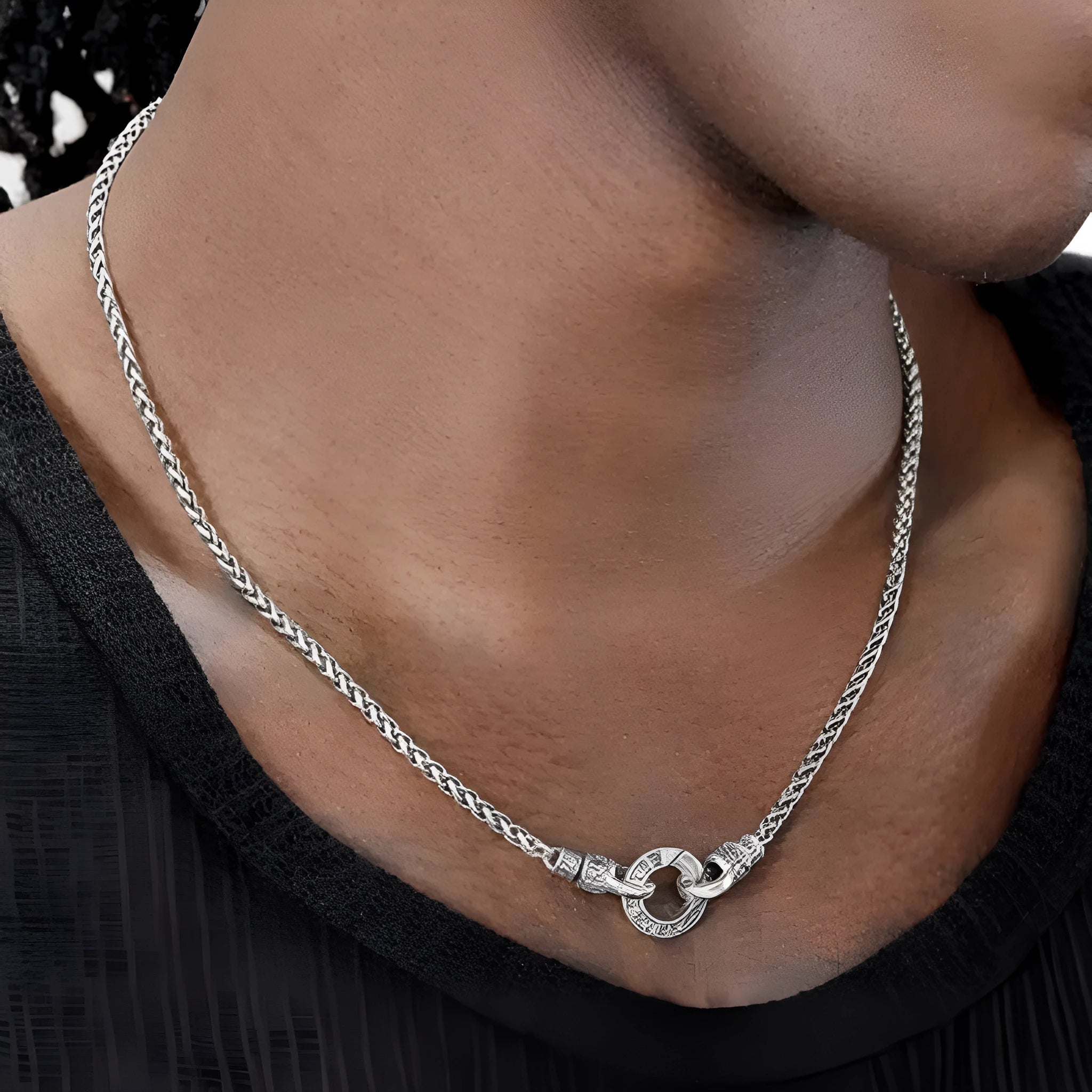 A sterling silver S925 clavicle necklace with a small pendant on a thin chain.