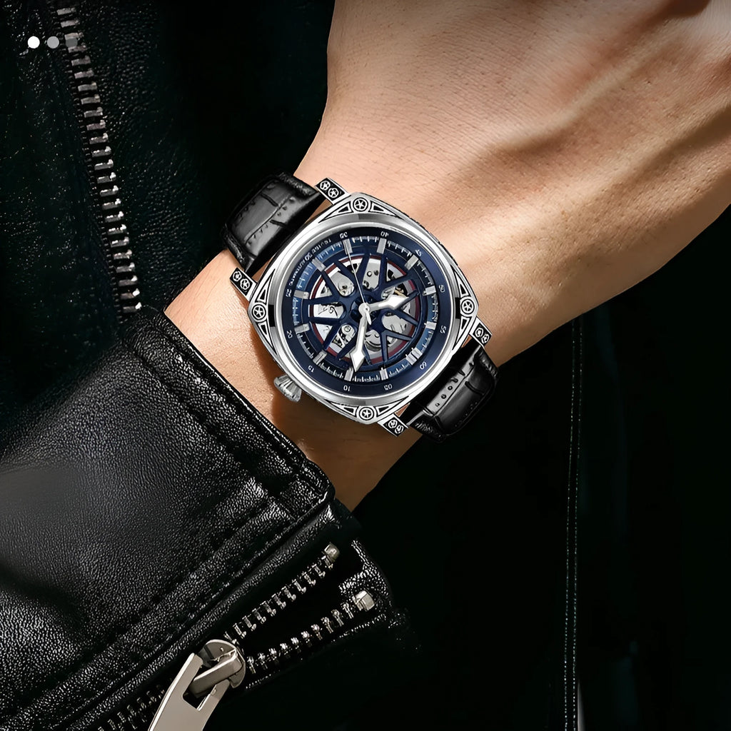 Men's stainless steel automatic watch with a blue leather strap showing the time.