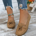 Women's suede flat shoes with a decorative bow in apricot colour