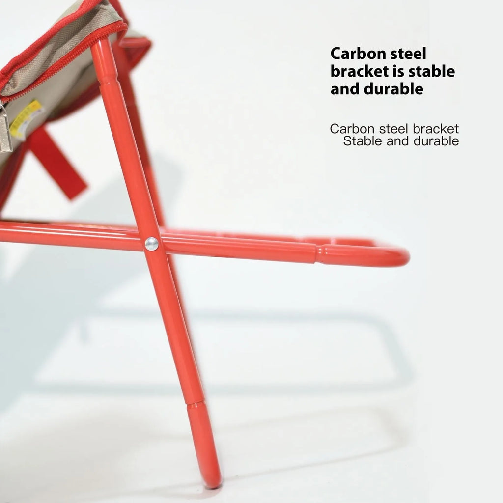 Lightweight foldable camp stool in khaki colour, shown folded flat in pencil box style.