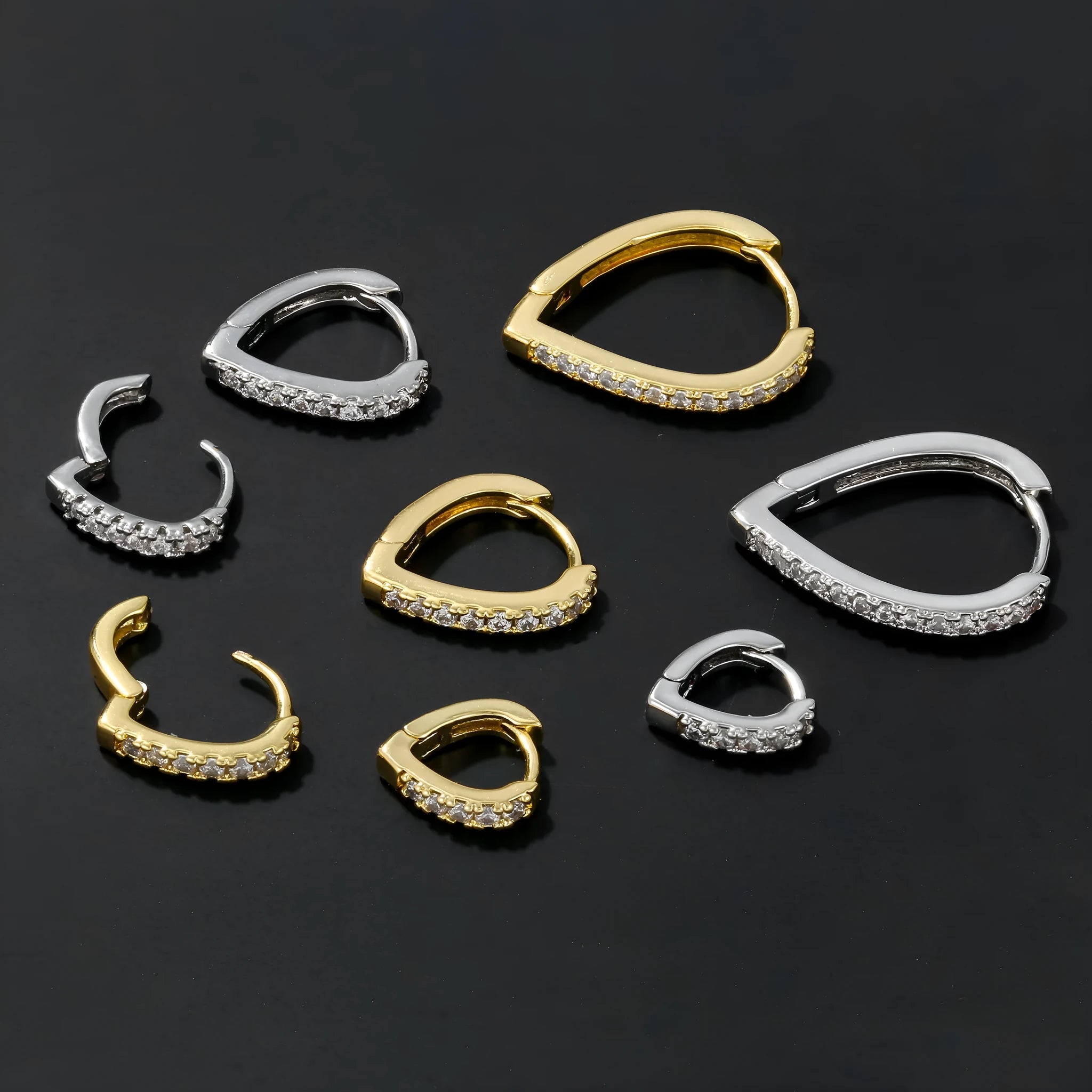 Geometrical heart-shaped gold and white gold electroplated copper ear clip for women.