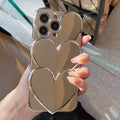 Soft TPU iPhone case with shiny 3D electroplating love design, shown next to matching bracelet.
