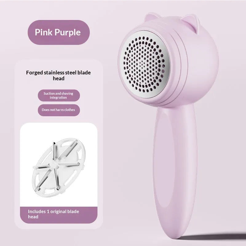 Small cat portable rechargeable lint remover in cream colour on fabric surface