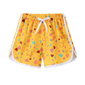Children's polyester shorts in assorted colours and prints including pineapple, kitten, and stripe designs.