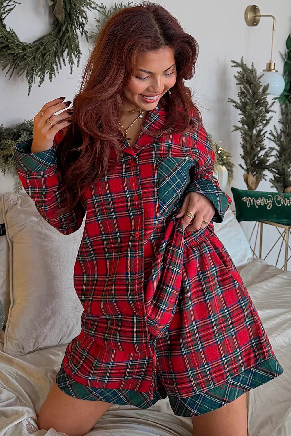 Red plaid long sleeve shirt and shorts Christmas pajama set with contrast patch details.