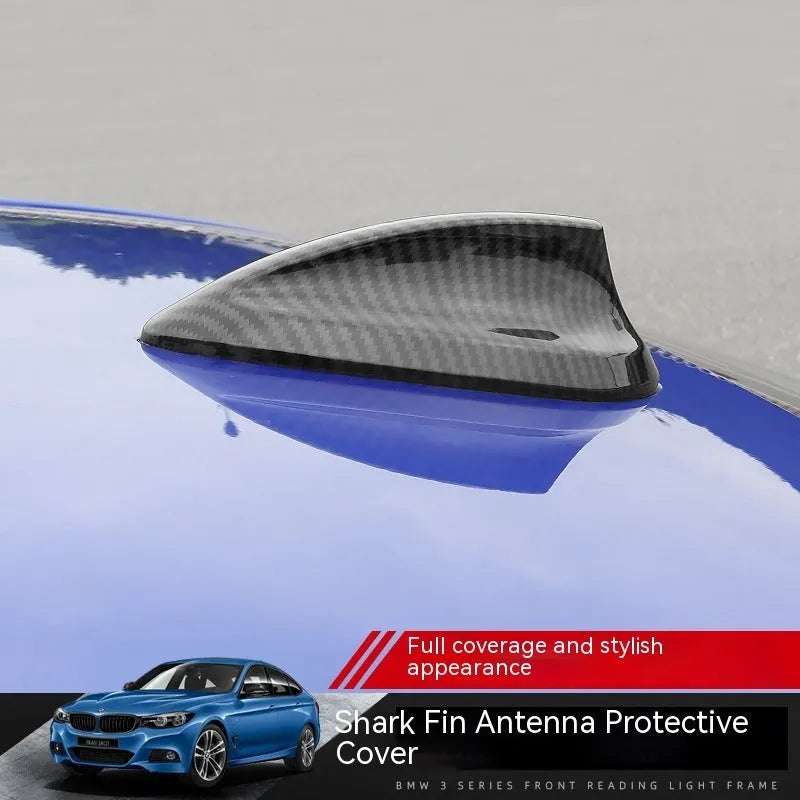 BMW shark fin antenna cover in carbon fibre and piano black finishes for Types A, B, and E.