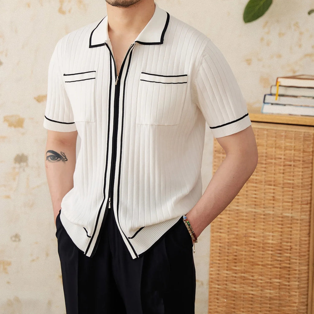 Slim fit black knitting polo shirt with short sleeves and a lapel collar laid flat.