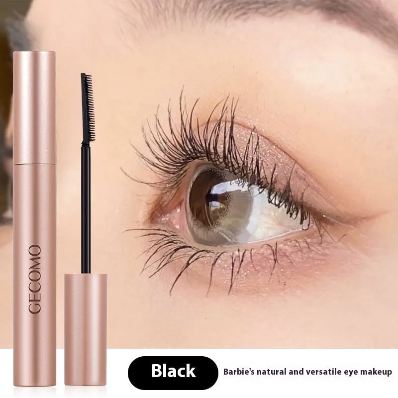 Black women's curly long mascara tube with brush, 14cm height, for lash volumising and definition