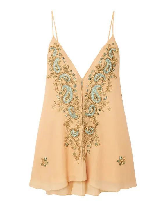 Light yellow women's sleeveless V-neck skirt with ethnic floral print, shown on a hanger.