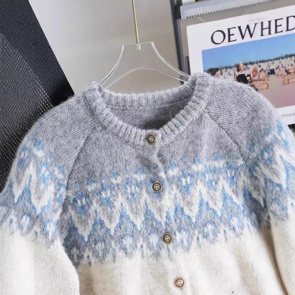 Women's beige jacquard knit sweater coat with a loose fit and long sleeves.