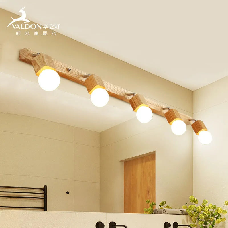 Single head mirror cabinet wall lamp with a 24cm diameter frame.